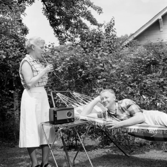 Senior couple relaxing in backyard Poster Print (18 x 24)