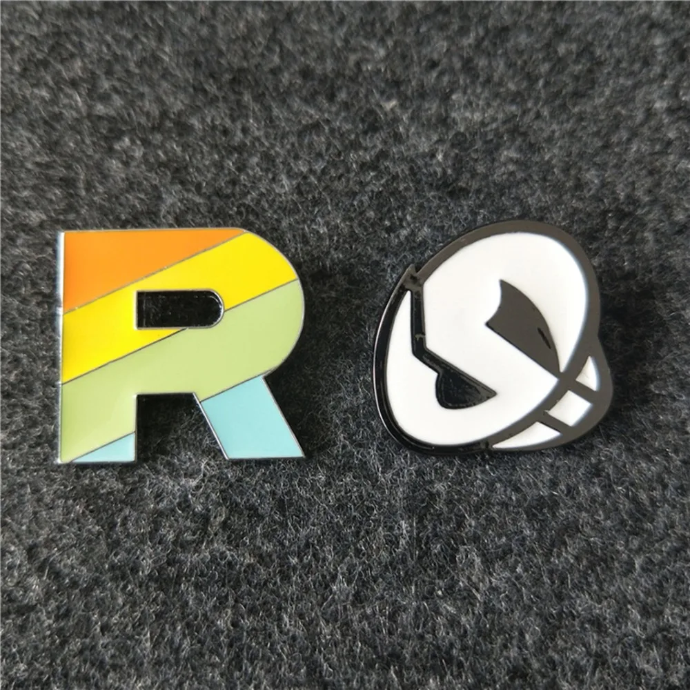 

Pokemon Cartoon Rocket Team R colorful brooch fashion novelty funny anime cos alloy brosche Jewelry souvenirs gift kids boy toys