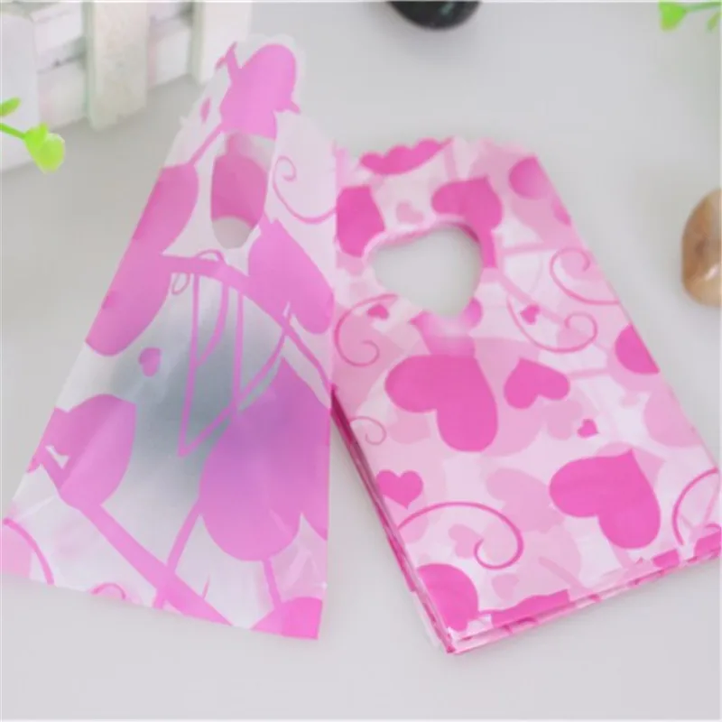 

New Design Wholesale 50pcs/lot 9*15cm Hot Pink Heart Plastic Packaging Bags With Handle Mini Jewelry Gift Pouches