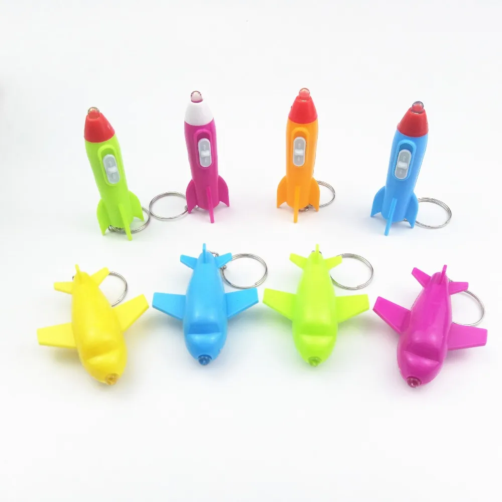 

Creative New Design LED FlashLight Cartoon Plane Rocket keychain Creative led light pendant Children Toys Wholesale 100pcs/lot