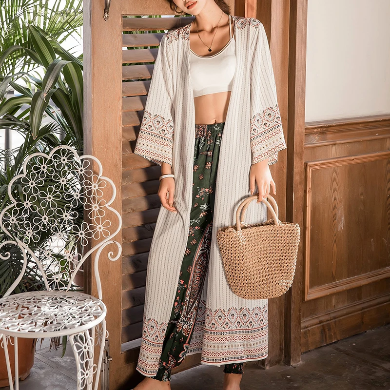 

Summer new women's clothes seaside holiday beach sun protection clothing long section loose national wind striped thin cardigan