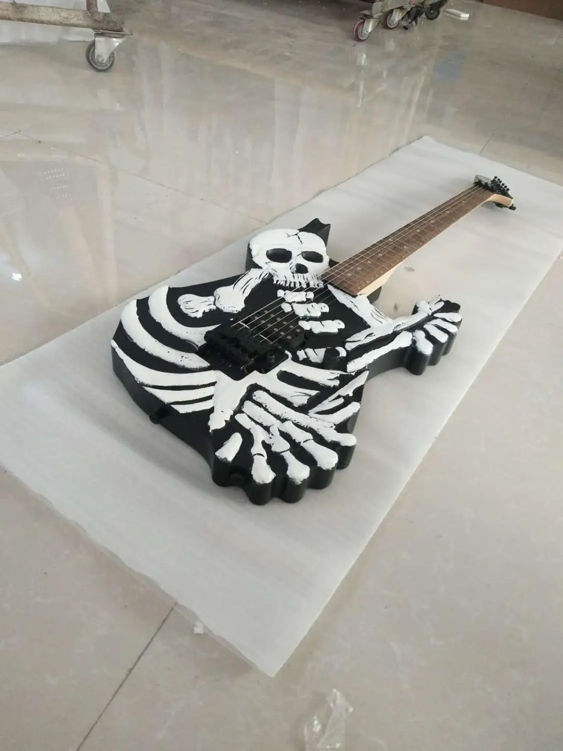 

Custom CNC carved skull 6 string electric guitar, black Floyd double swing bridge, free delivery