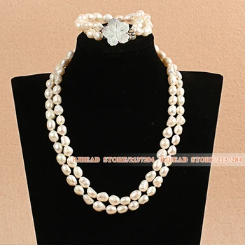 

Baroque Style Double Strand 8-9mm Natural White Oblate Pearl Jewelry Set With Shell Flower Clasp (Necklace & Bracelet)
