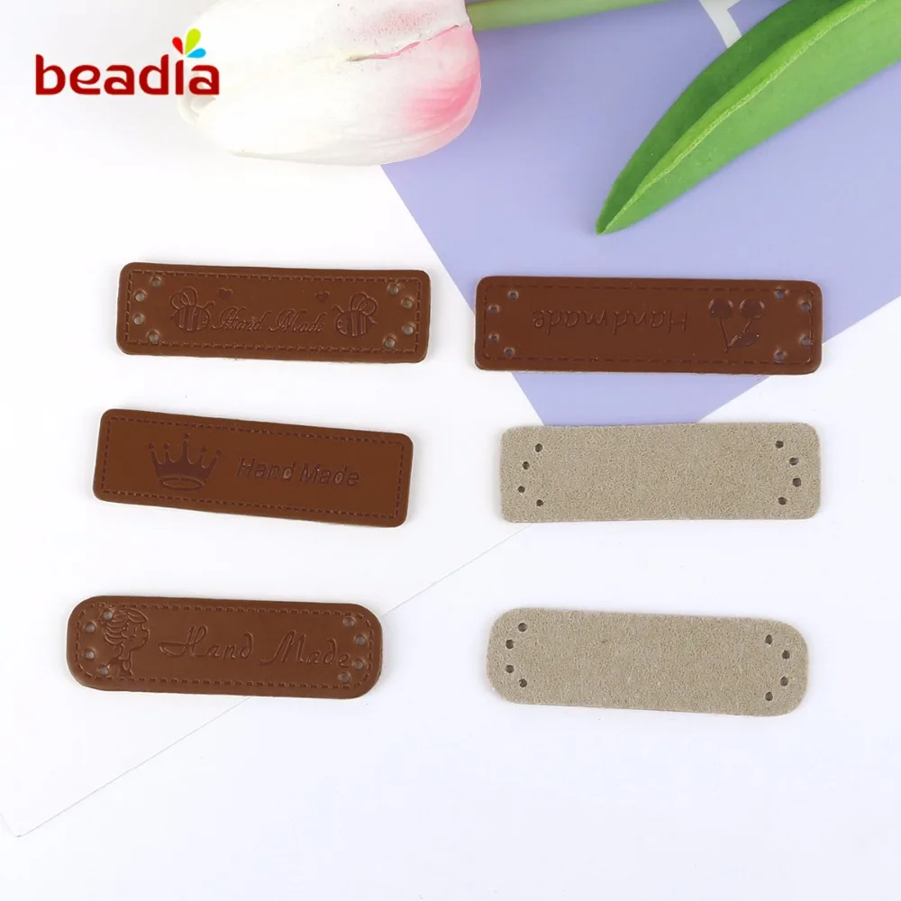

New 24pcs/lot Hand Made PU Leather Labels for Clothes Garment Hat Handmade Jeans Bags Shoes Labels Tags DIY Sewing Accessories