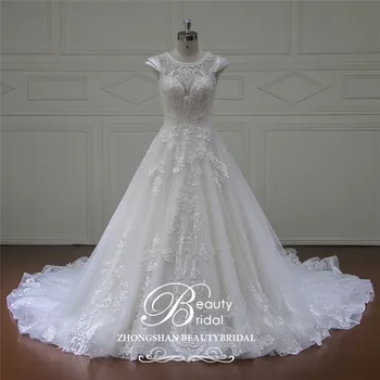 شراءBeautybridal 100% ريال صور فاخر فستان الزفاف الملكي قطار الدانتيل يزين تول كاب كم فستان الزفاف 2019 Vestido Xfm004