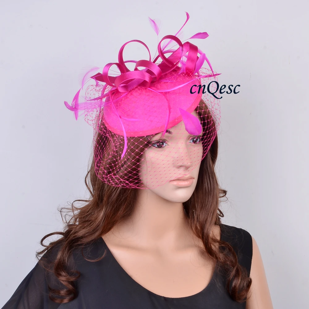 

Cerise fuchsia hot pink Fascinator felt hat wedding race carnival fascinator with feathers and veiling.