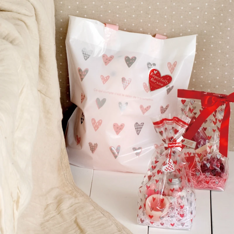 

50pcs Pink Heart Plastic Shopping Gift Packing Bag With Handle