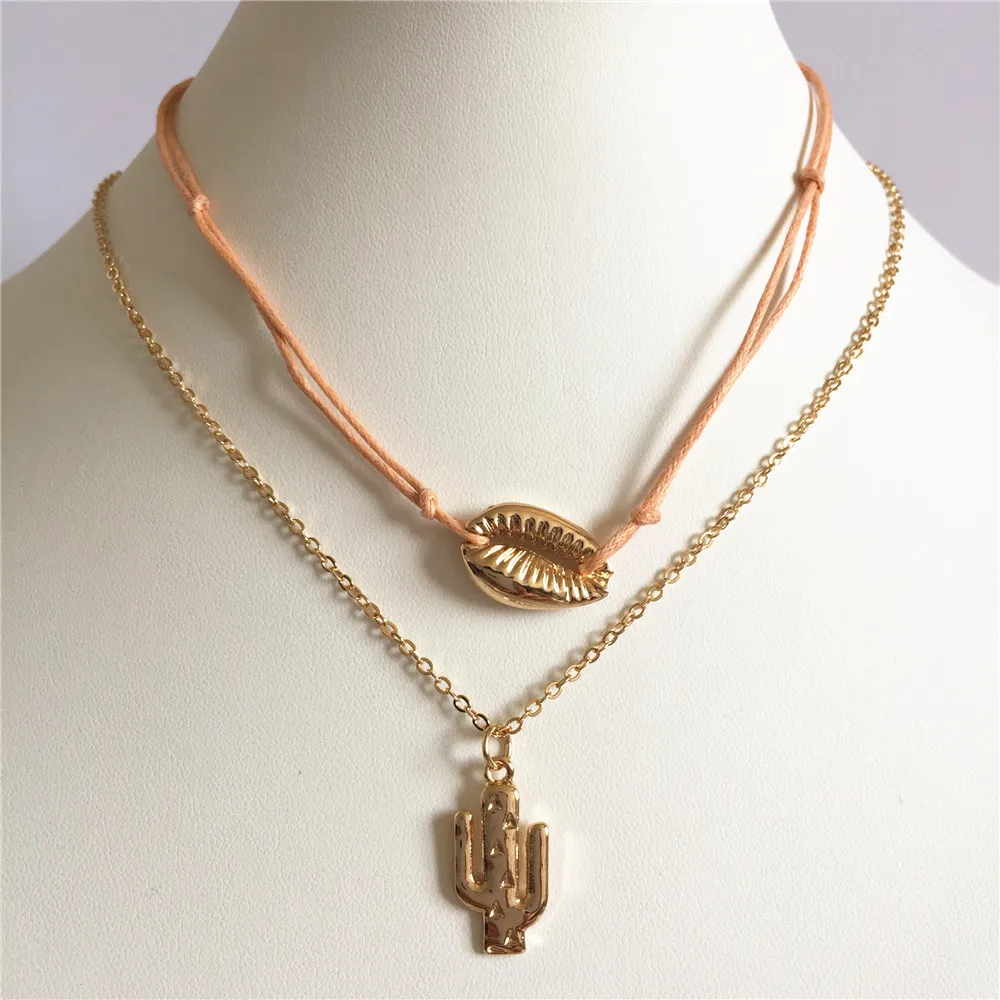 

Gold color with peach cord cactus pendant and shell layered necklace