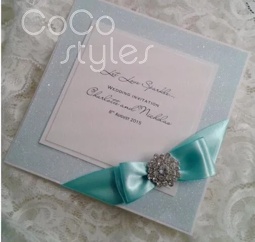  Cocostyles customized elegant glitter invitation card with brooch and ribbon for fantasy wedding in - 32890337548