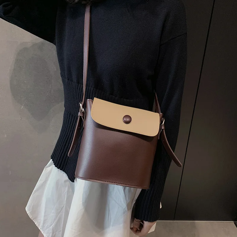 

2019 new pu hit color shoulder bag Bucket button diagonal girl bag Korean version of simple spring handbag