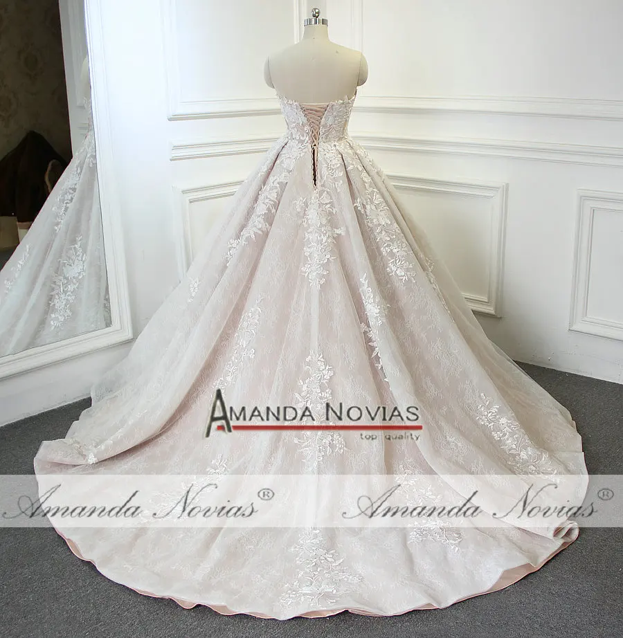 Свадебное платье трапециевидной формы цвета шампанского без бретелек от Amanda Novias