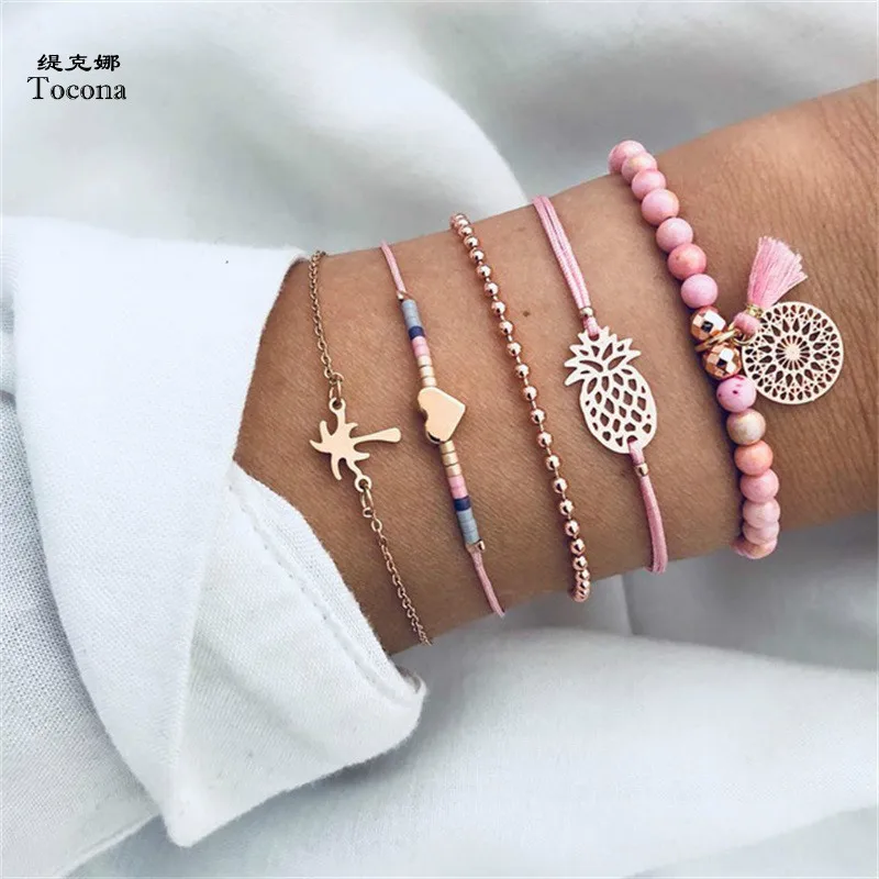 

Tocona 5PCS/Set Bohemia Pineapple Coco Tree Heart Beads Charm Chain Bracelets Set Gold Alloy Bangle Jewelry for Women 6669