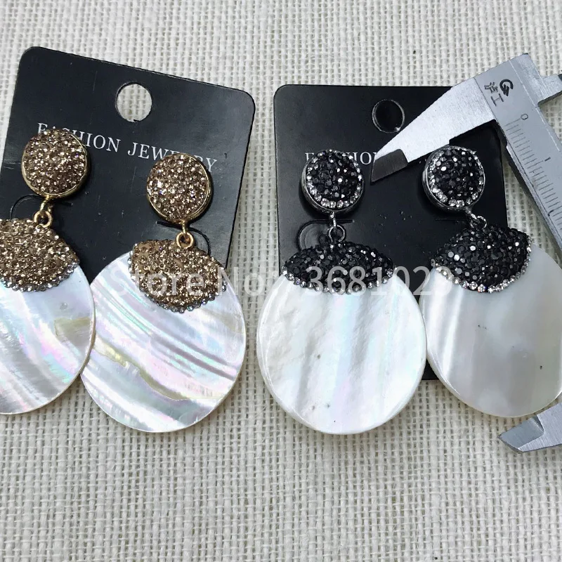 

Круглые длинные темпераментные женские серьги-ракушки 2018