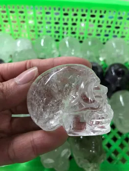 

natural stones and clear quartz crystal skull