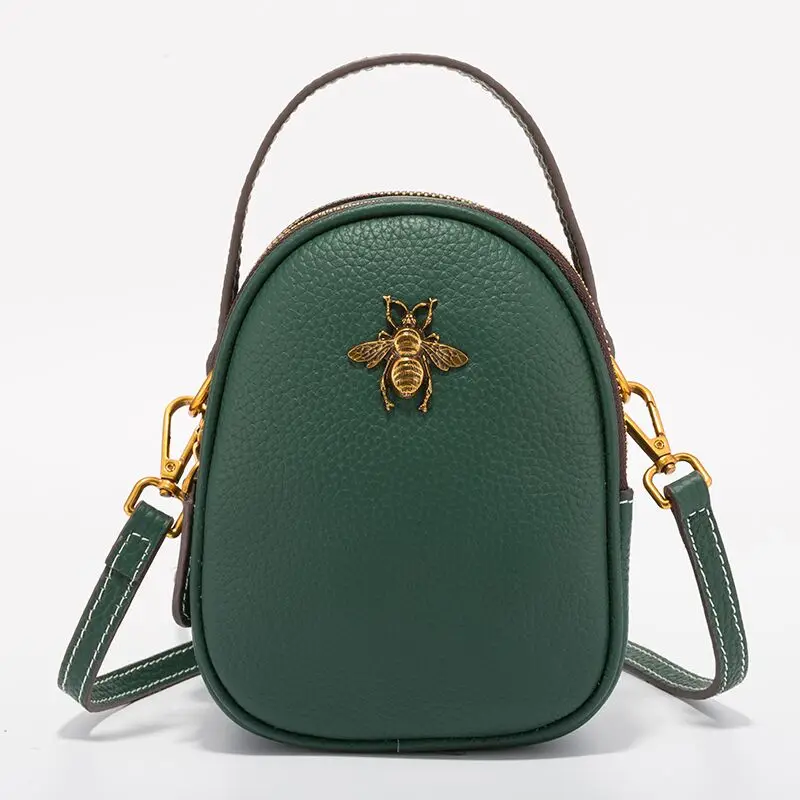 

Fashion high-end leather texture ladies bag small round bag bee bag solid color luxury red diagonal shoulder bag