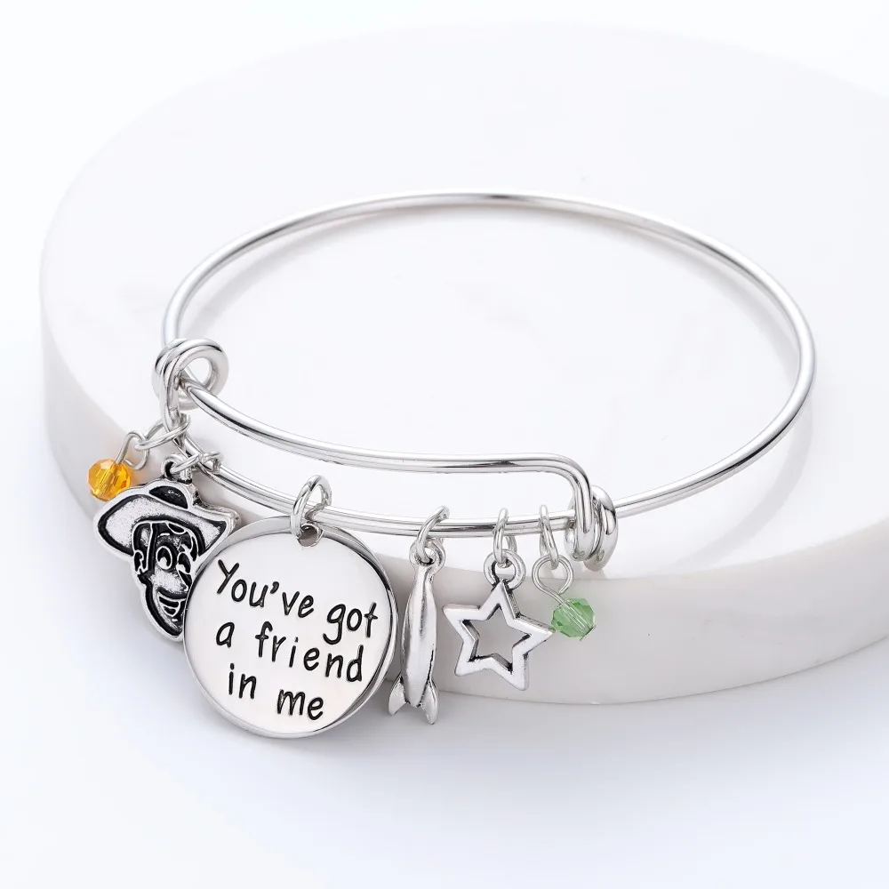 

Toy Story You've got a Friend in me Charm Bracelet with Woody,Aircraft,Star Charms Copper Expandable Bangle Christmas Gift BFF