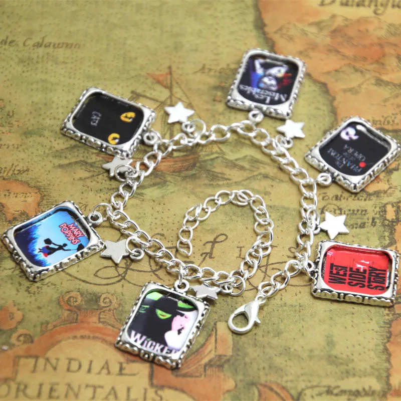 12pcs Broadway Musical wicked with different playbills charm bracelet silver tone 12pcs Broadway Musical wicked with different playbills charm bracelet silver tone