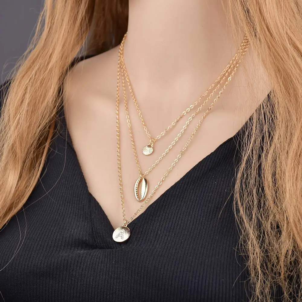 

Gold Chain Sea Shell Pendant Necklace for Women Seashell Charm Layered Necklace Crystal Letter Necklace Chokers Jewelry 2019