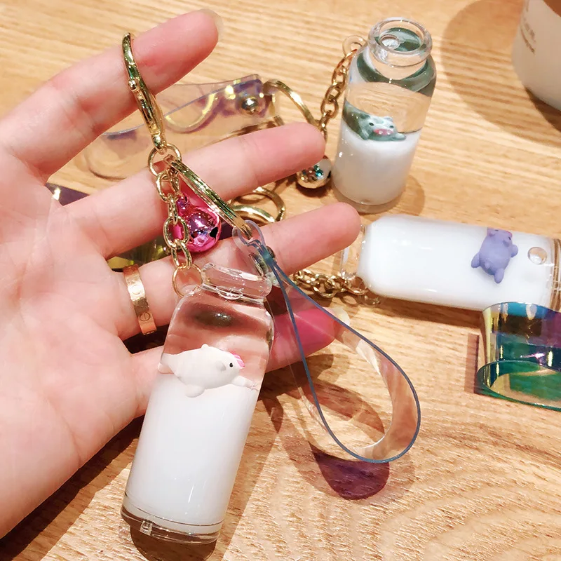 

2019 Floating piglet liquid bottle keychain quicksand drift bottle milk bottle keyring for women bag pendant