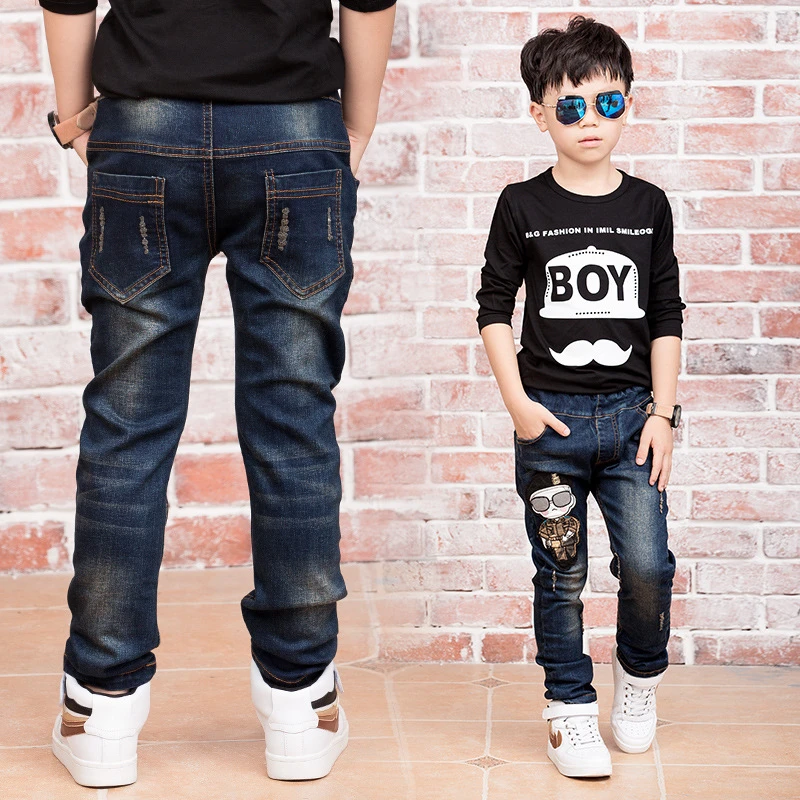 boys wearing ripped jeans