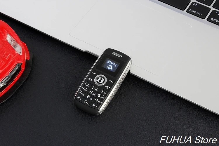 Милые Мини ключа автомобиля модель телефона Dual Sim карты Bluetooth соединение с функцией Magic Voice MP3 одним из ключевых Запись мобильный телефон