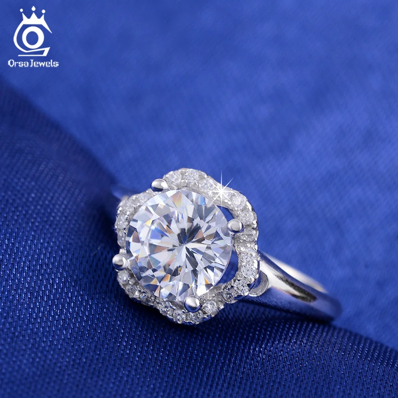 ORSA JEWELS Fashion Jewelry Flower Wedding Ring for Women Engagement Rings with One Big Luxury 2 Carat AAA Cubic Zirconia OR34