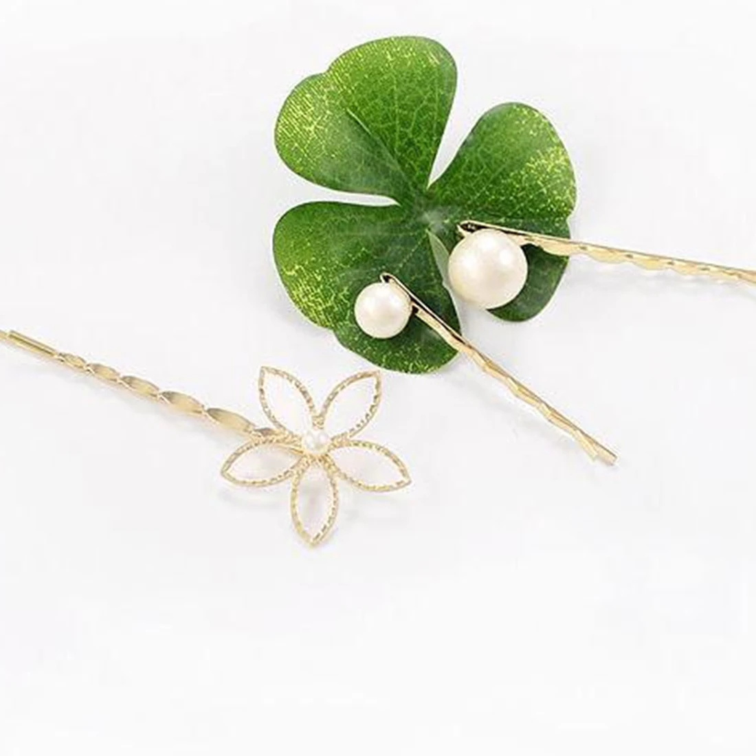 

Popular Spring and summer hairpin five-petal flower pearl hairpin hollow three-piece set of seaside clip top clip