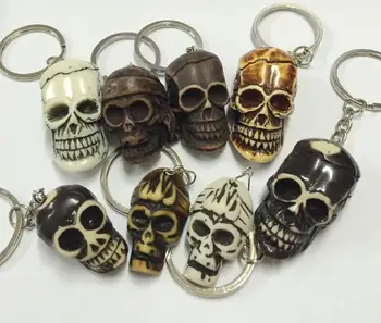 

FREE SHIPPING 16 PCS Bone Powder Tibetan carving skull totem talismans keychain Jewelry