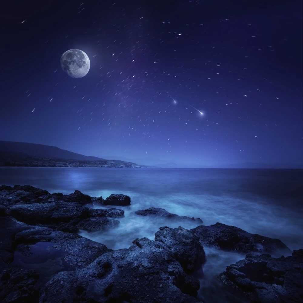 Rocks seaside against rising moon and starry field  Crete  Greece Poster Print (28 x 28)