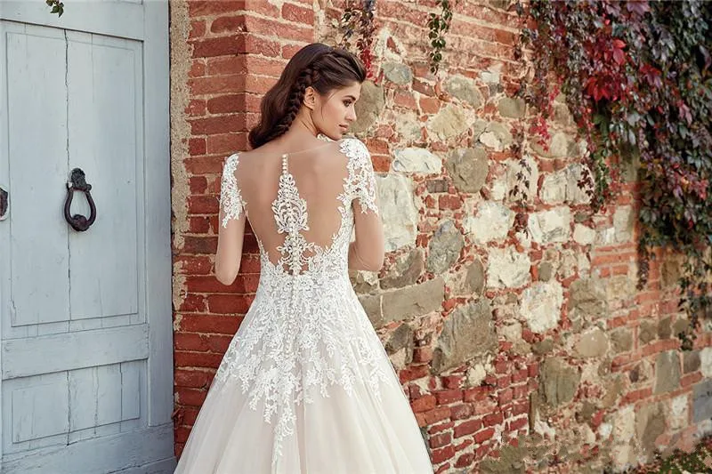 vintage-long-sleeve-wedding-dresses-a-line-sheer-neck-backless-with-button-covered-long-summer-bohemian-bridal-gowns (3)