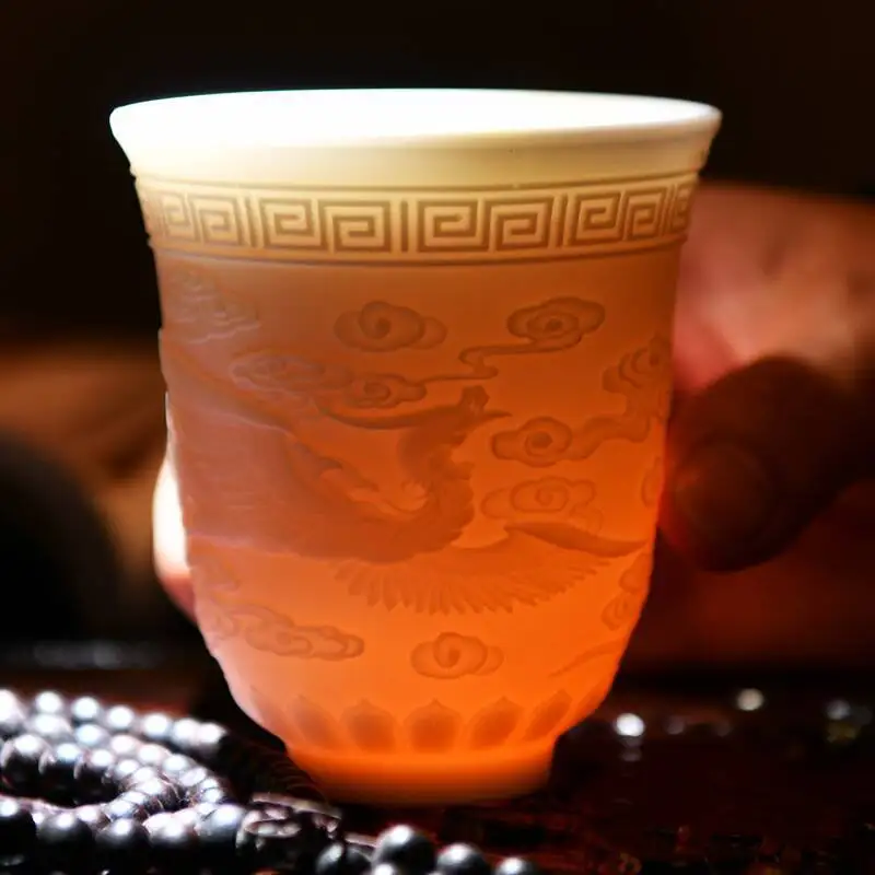 

Dehua White Porcelain Tea Master Cup Kung Fu Cup Ceramic Relief Dragon and Phoenix Appear, Auspicious Qi