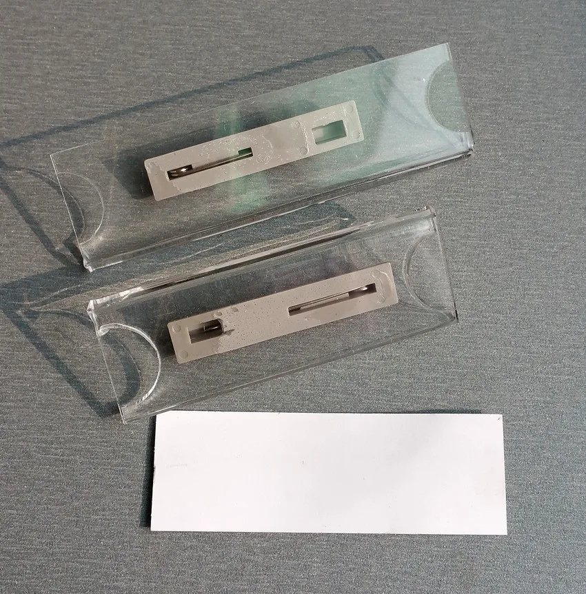 

Good Quality Acrylic Plastic Staff Number Name Badge Plate Clip Holders In Clear With Safty Pin On Back Reusable 1000pcs