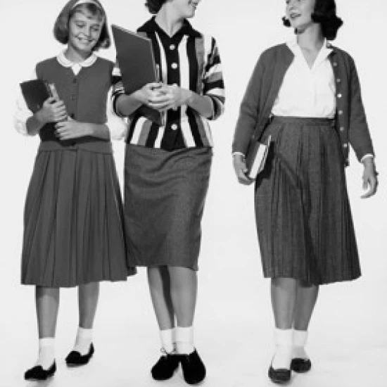 Three teenage girls walking together and smiling Poster Print (24 x 36)