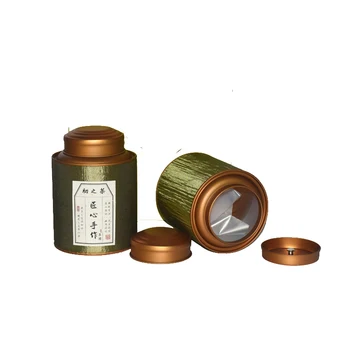 

Shandong Xin Jia Yi Packaging Box Silk Ribbon Surface Strong Paper Tube Large Green Tea Can with Double Golden Lid Wholease Cans