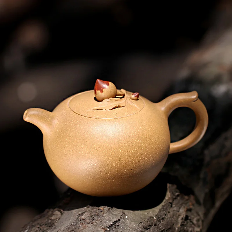 

Yixing famous craftsmen TaoJianChun TaoYuan 】 all hand yixing teapot undressed ore recommended peach pot