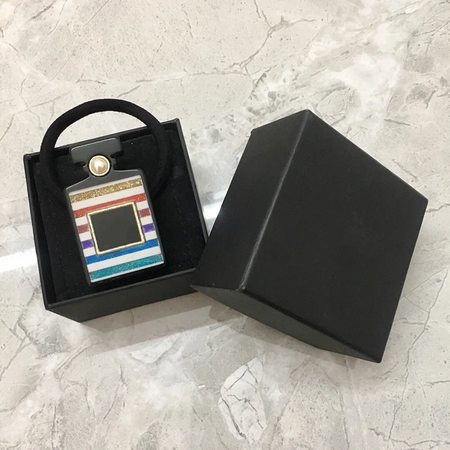 

2019 Top Selling Hot Luxury Brand C Hair Jewelry For Women Bling Bling Rainbow Perfume Bottle Acrylic Elastic Hair band Ribbons