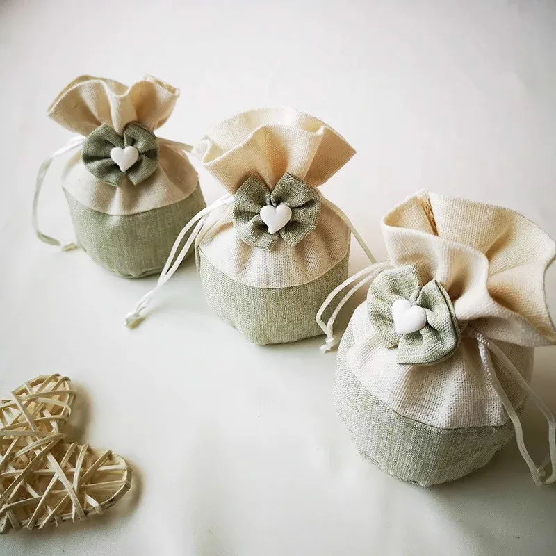 

12pc Drawstring Cotton Linen Fabric Heart Bowknot Bag Natural Burlap Hessia Candy Bags Wedding Party Favor Pouch Jute Gift Bags