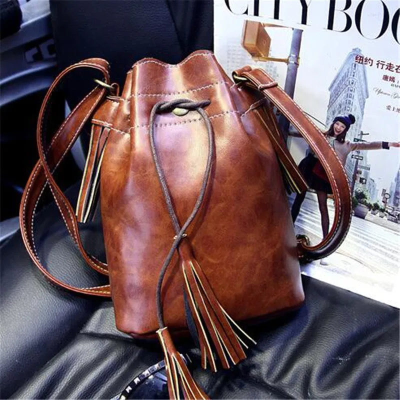 

2016 new European and American retro multicolor fringed handbag pumping with a small bag bucket bag shoulder bag Messenger bag