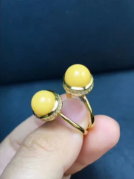 

High-grade 925 silver inlaid honey wax Egg face ring genuine natural yellow honey amber ring retractable ring female models