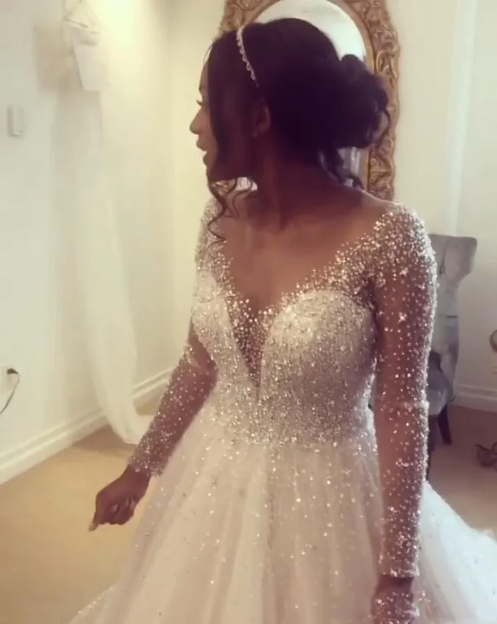 sheer-jewel-neck-a-line-boho-wedding-dresses-with-long-sleeves-beaded-crystals-bridal-dresses-hollow-zipper-back-wedding-gowns-for-brides