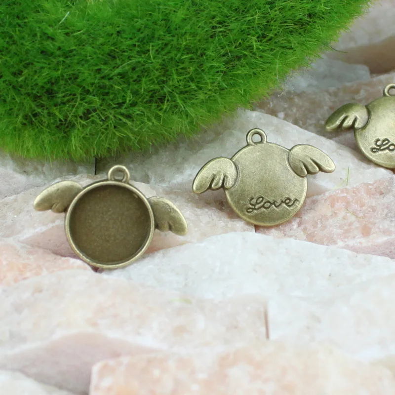 

Старинная бронзовая оправа для подвесок 12 мм, 60 шт., 24*16 мм, стеклянный кабошон, основа для камеи, рамка с крылом, фурнитура для изготовления ювелирных изделий без рисунка