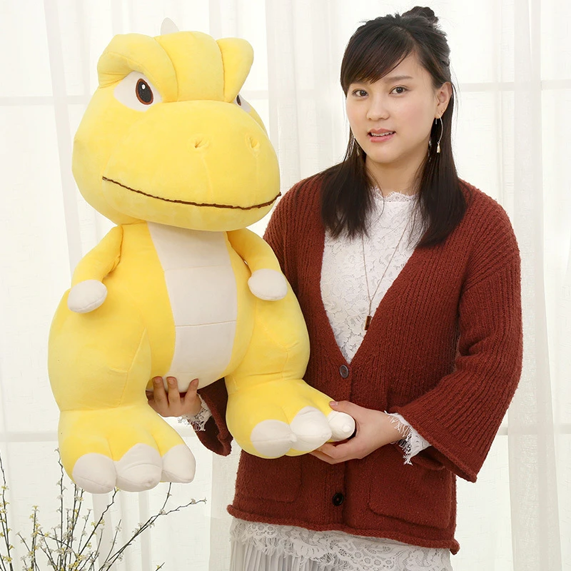 yellow stuffed dinosaur