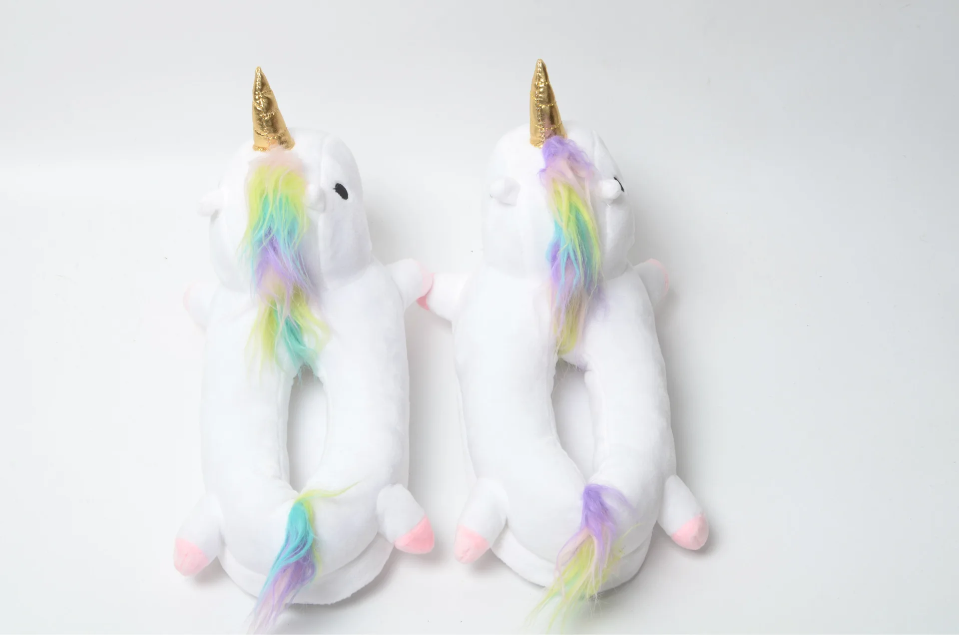 A Pair of White Unicorn Slippers looking from above