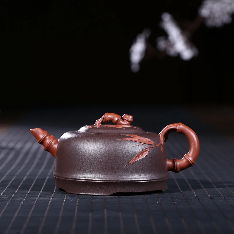 

Quality Goods Famous Manual Raw Ore Two Colors Of Purple Clay Bamboo Joint Kettle Kungfu Online Teapot Tea Set Wholesale
