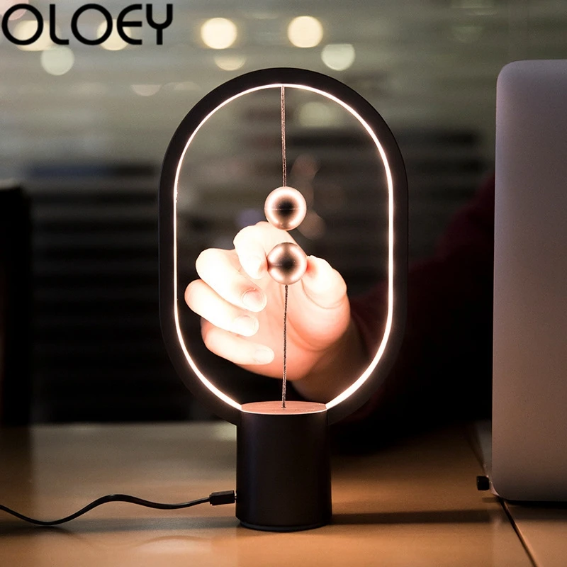 Najtaniej Europejska kreatywna lampa stołowa magnetyczna owalna lampa stołowa indukcyjna salon dekoracja sypialni nowość