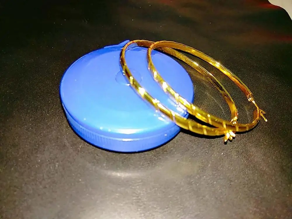 

Large gold earrings with single stripes