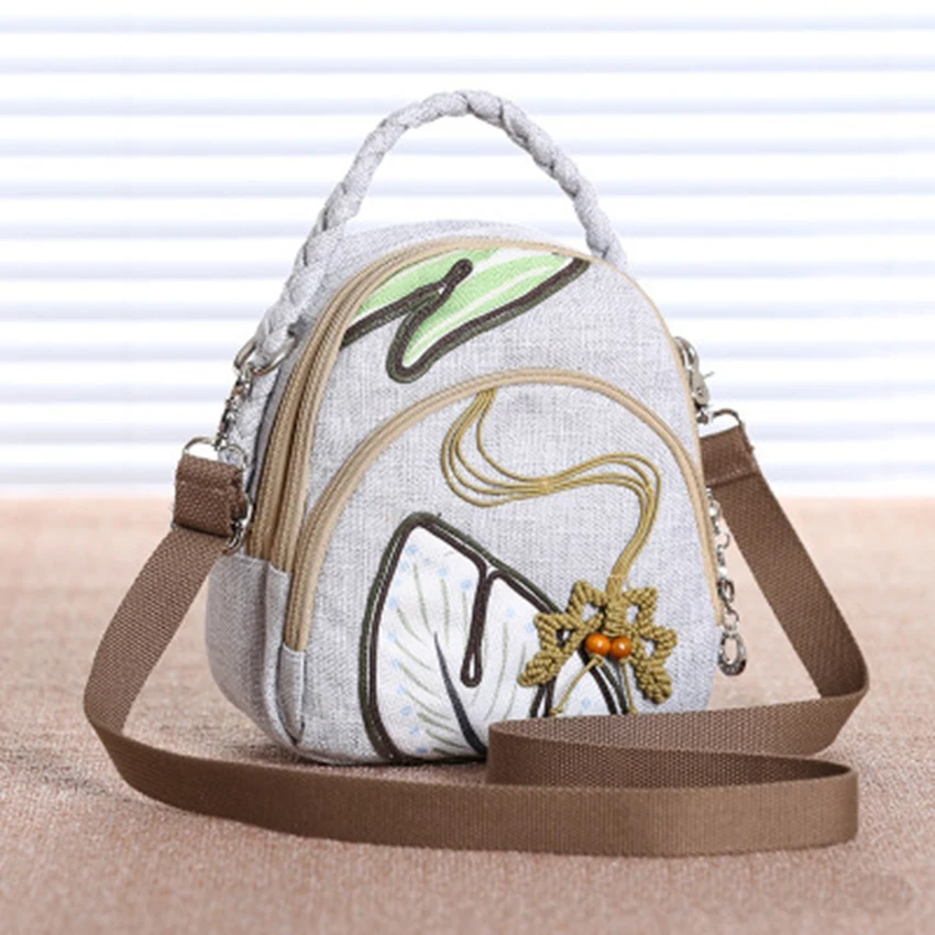 

Mini portable slung shoulder bag washable ethnic style hand-woven lotus leaf light multi-layer handbag travel vacation shoulder