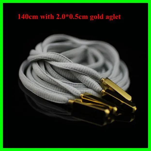 white flat laces with gold tips
