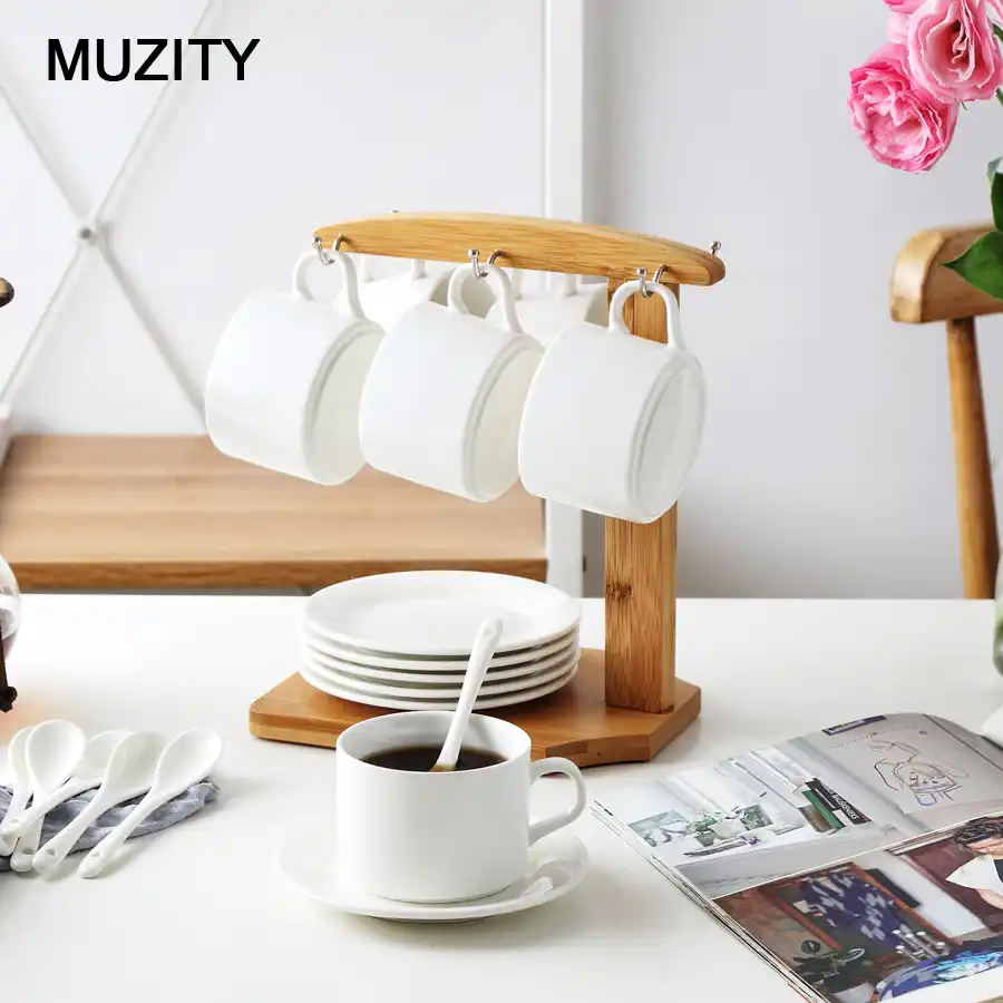 Muzetti Anas طقم فناجين شاي سيراميك أبيض مع حامل أكواب من الخيزران بتصميم بسيط وكوب وصحن Muzetti Anas طقم فناجين قهوة وصحون