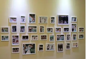 

The photo wall.. 34 frame combination. Wedding studio sitting room sofa background wall